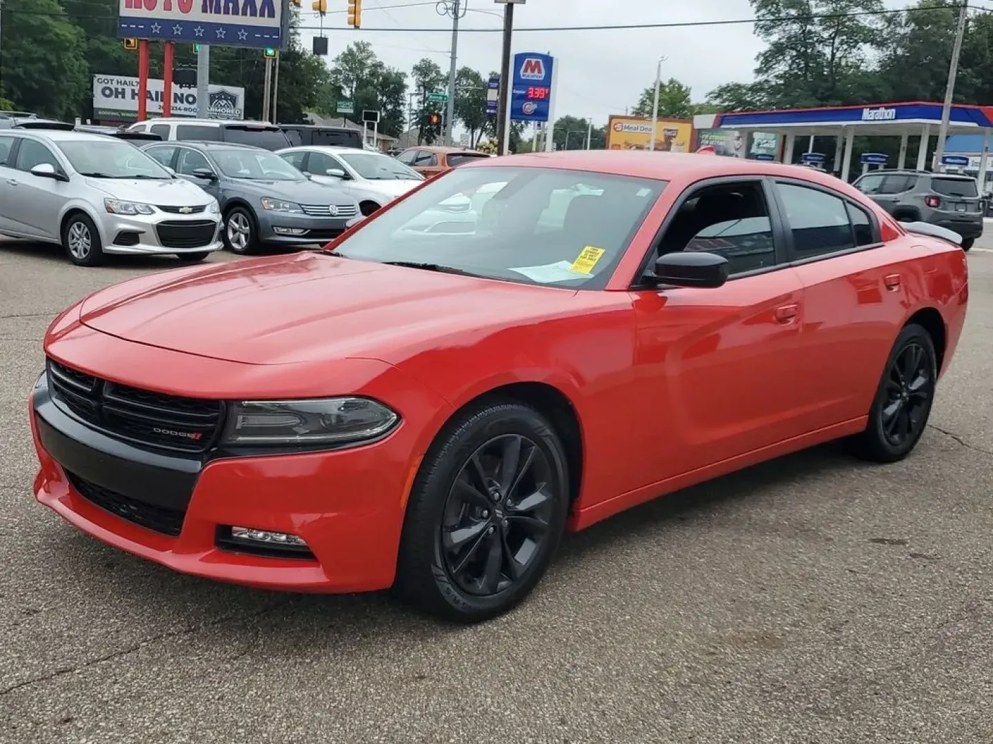 2020 Torred Clearcoat /Black Dodge Charger SXT (2C3CDXJG7LH) with an V6, 3.6L engine, 8-speed automatic transmission, located at 6064 Gull Rd, Kalamazoo, MI, 49048, (269) 222-0088, 42.328388, -85.512924 - <b>Summary</b><br>Aftermarket sport exhaust<br><br><b>Vehicle Details</b><br>Aftermarket sport exhaust. Looking for a dynamic blend of performance and comfort? Check out this 2020 Dodge Charger SXT, equipped with All-Wheel Drive and a powerful V6, 3.6L engine. This standout sedan balances thrilling - Photo#3